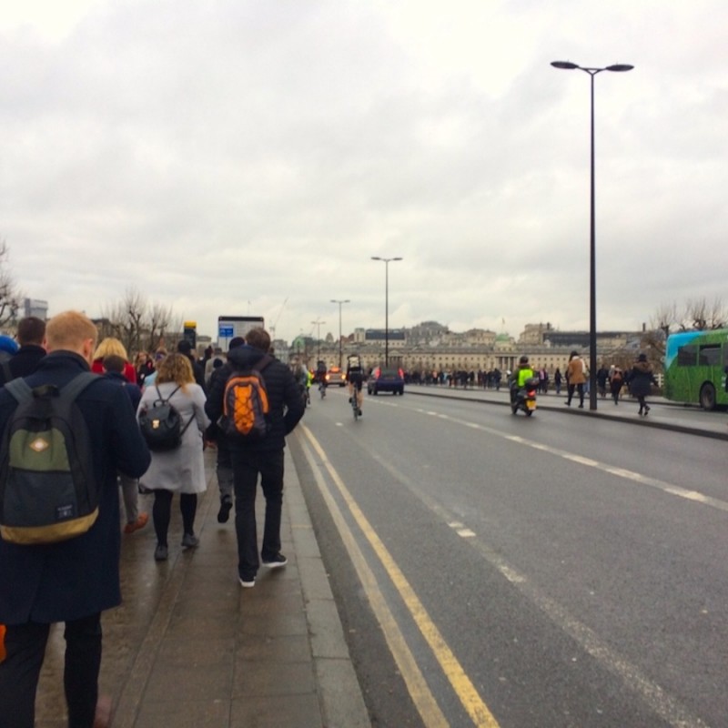 Tube strike London walkers on bridge